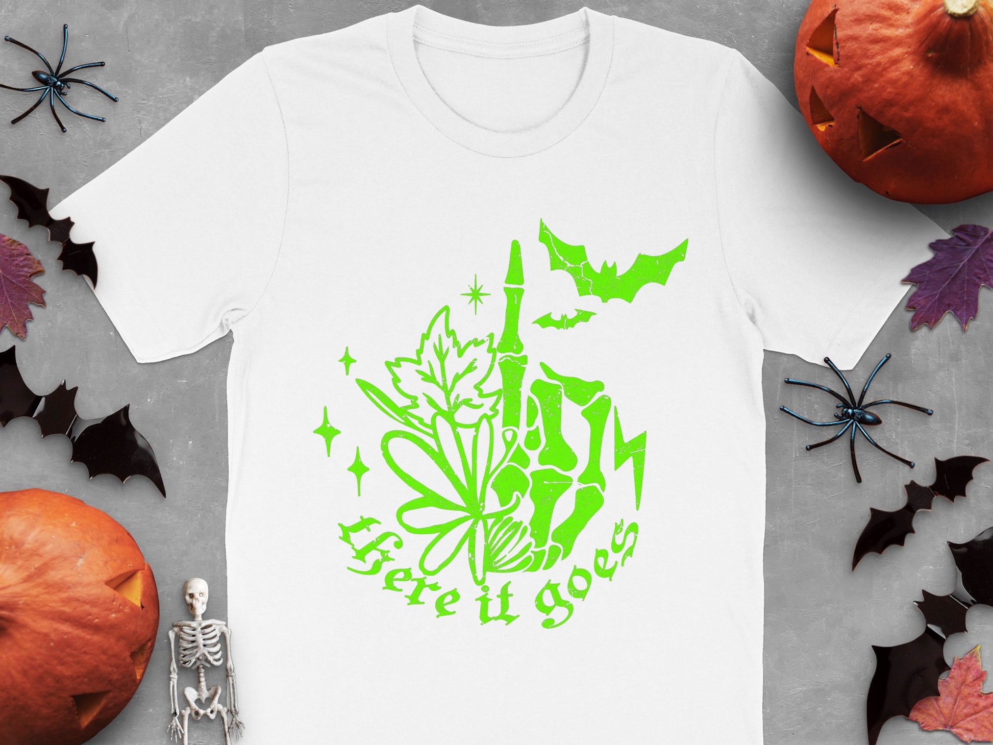 Halloween Themed T-Shirt with Skeleton, Pumpkin, and Bat Graphics, Festive Fall Apparel