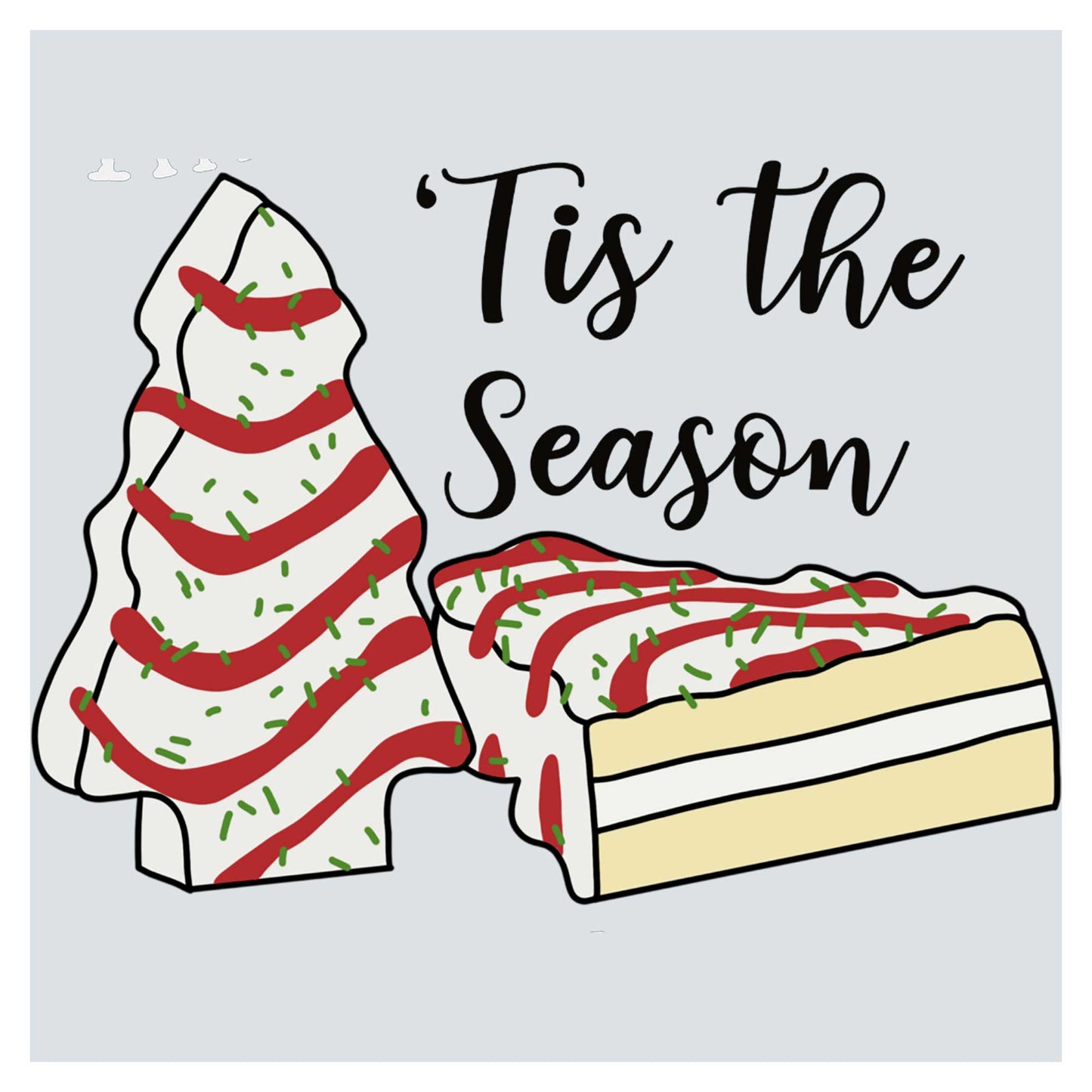 a piece of cake sitting next to a christmas tree