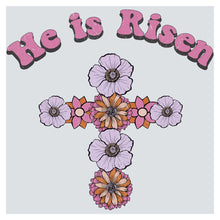 a cross with flowers and the words he is risen