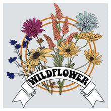 a bouquet of wildflowers with a ribbon around it