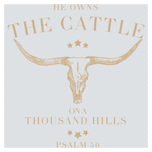 a cow skull with stars on it and the words he owns the cattle on a