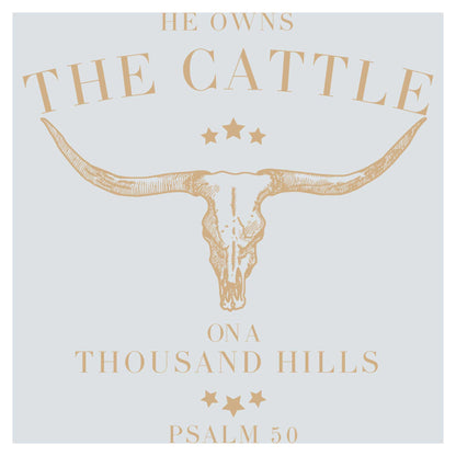 a cow skull with stars on it and the words he owns the cattle on a