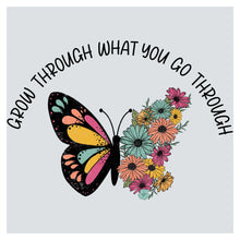 a butterfly with flowers on it and the words, grow through what you go through