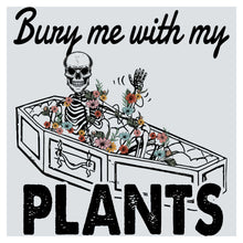 a skeleton sitting in a planter with flowers